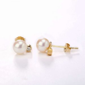 white pearls and diamond earrings
